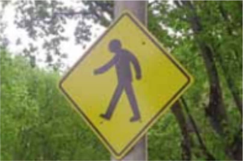 Señal de transito de advertencia que indica paso de peatones